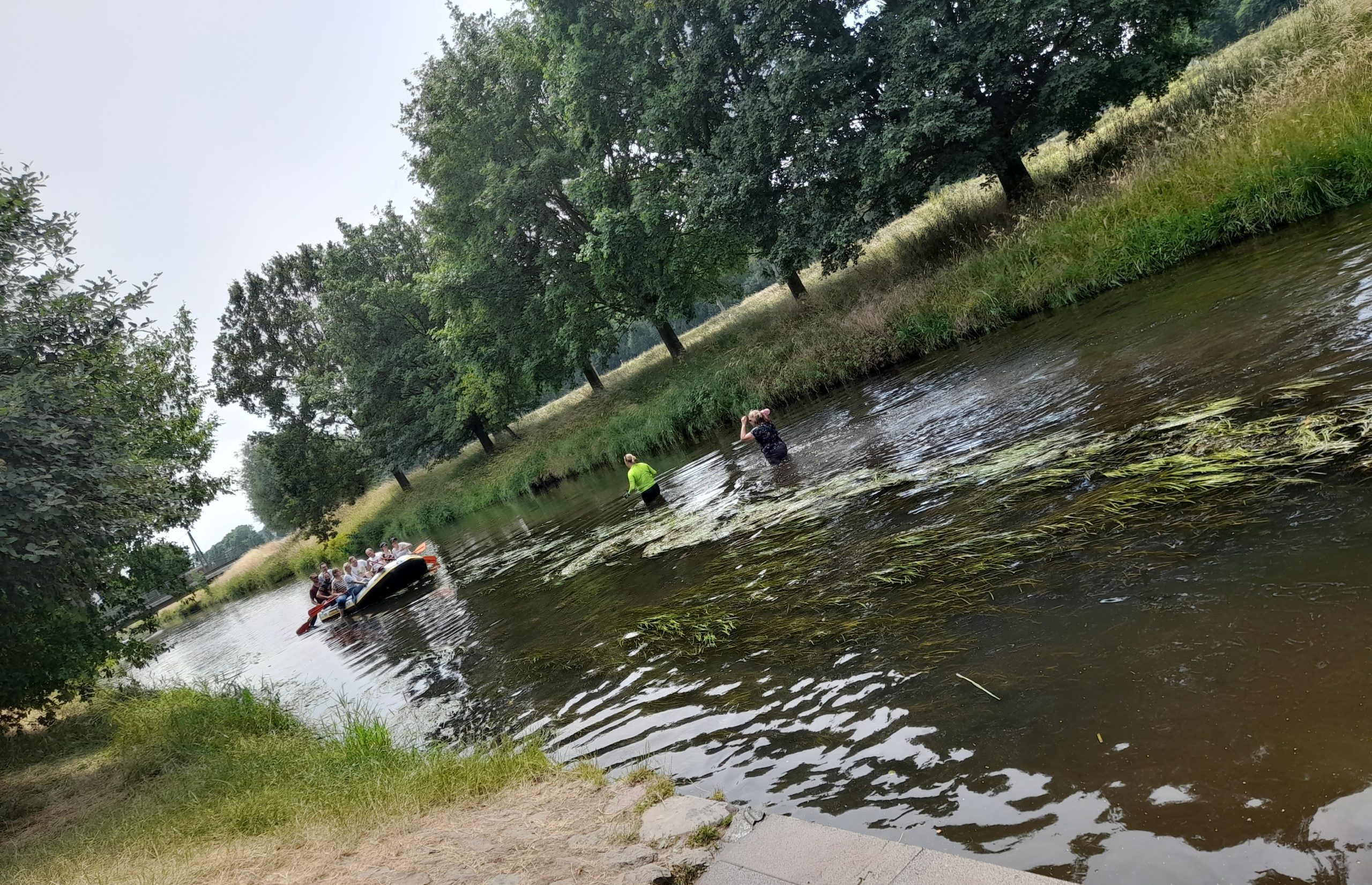 Two brave colleagues refreshed in the cool water at the end of the stage.